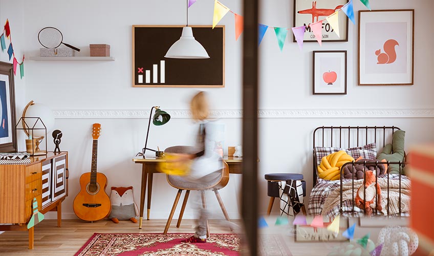 Child's bedroom with guitar, desk, and colorful decor, ideal for showcasing EMF shielding paint solutions