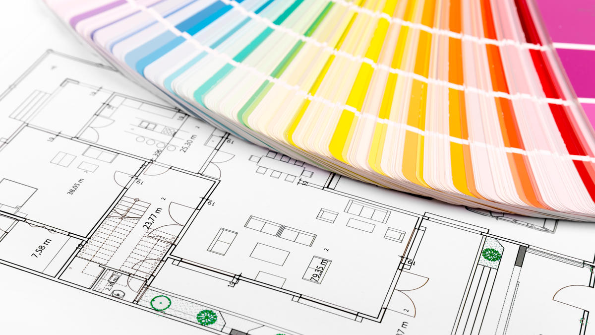 Color swatch palette in a gradient from pink to blue placed on top of a detailed architectural floor plan for a home interior.