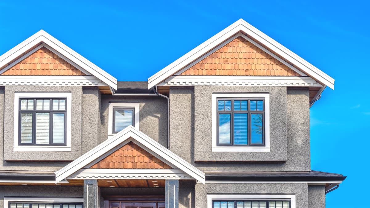 Residential home exterior with stucco walls and detailed trim, illustrating factors that influence house painting cost in Los Angeles.