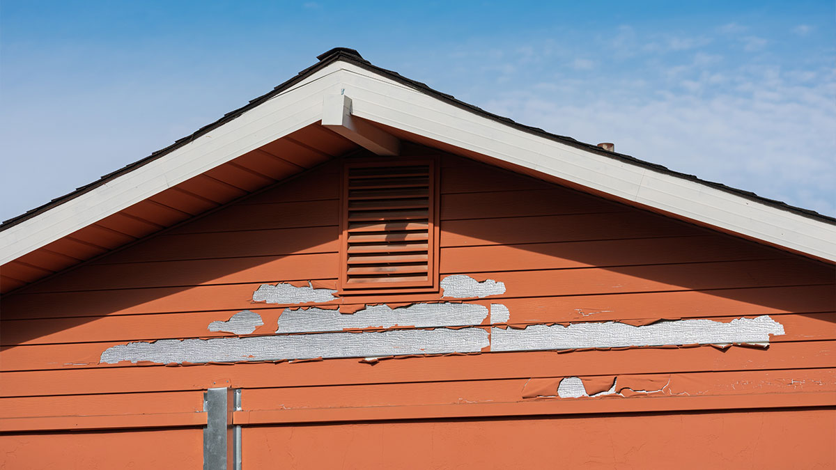 Peeling exterior paint on wood siding showing clear signs it is time to repaint or restore a house exterior in Pacific Palisades