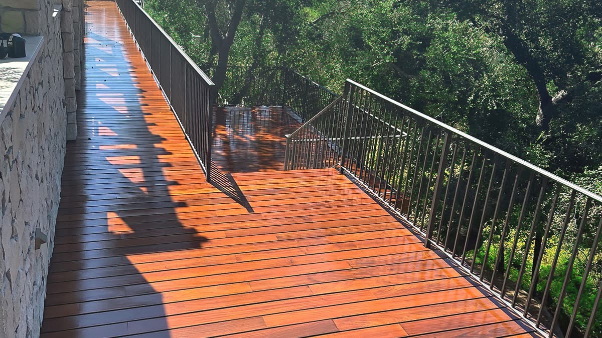 Refinished teak or IPE-style deck at a coastal Los Angeles home by Tilo Martin Painting
