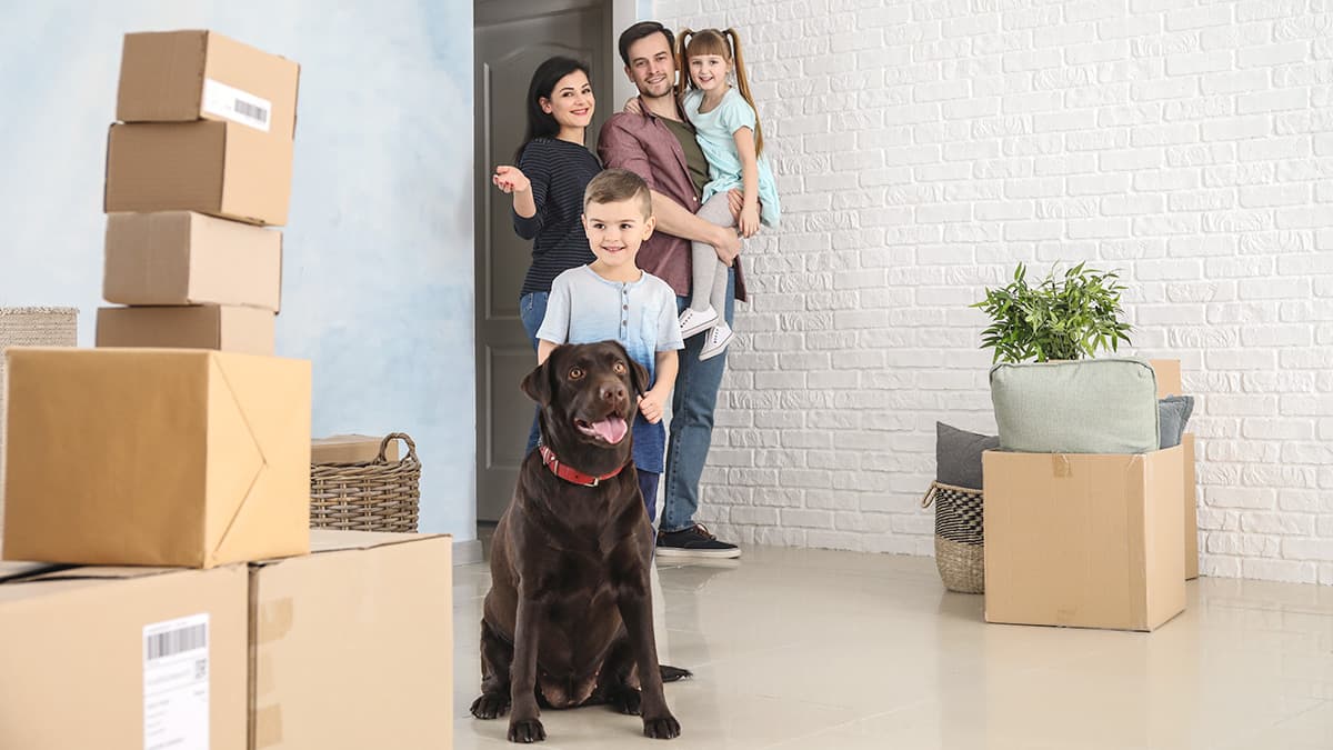 Family with two children and a dog preparing their home for an interior painting project