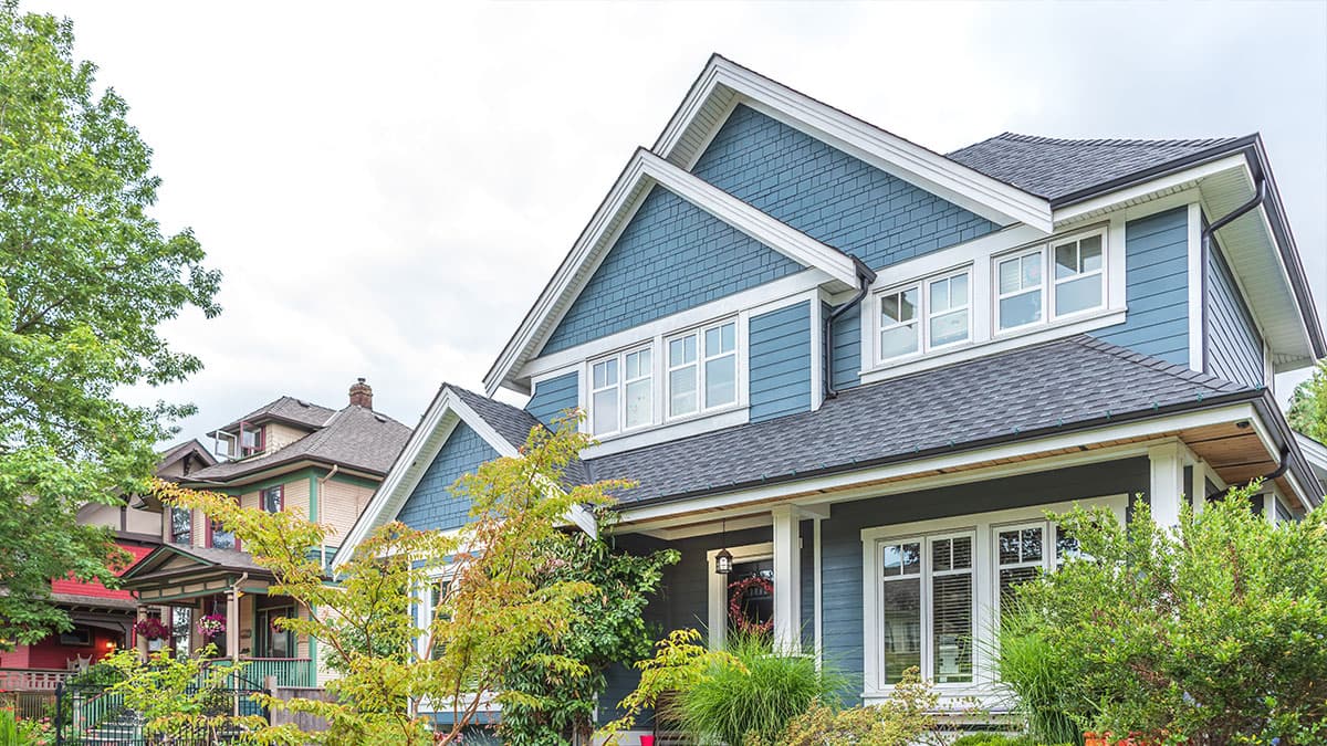 Two-story Pacific Palisades home with blue exterior paint and crisp white trim
