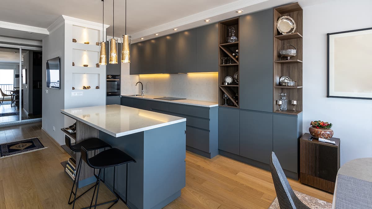 Blue-gray cabinets and a matching island, showing kitchen cabinet refinishing inspiration for Marina del Rey homes.