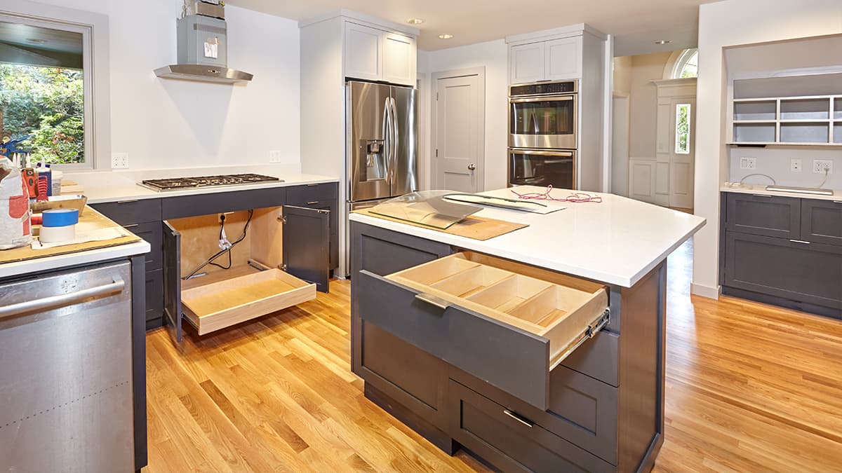 Two-tone kitchen cabinets with open drawers, illustrating cabinet refinishing for Marina del Rey homes.